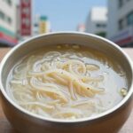 서리태 콩국수 그릇에 담긴 완성 모습, 고소한 콩물과 쫄깃한 면발이 어우러져 있다